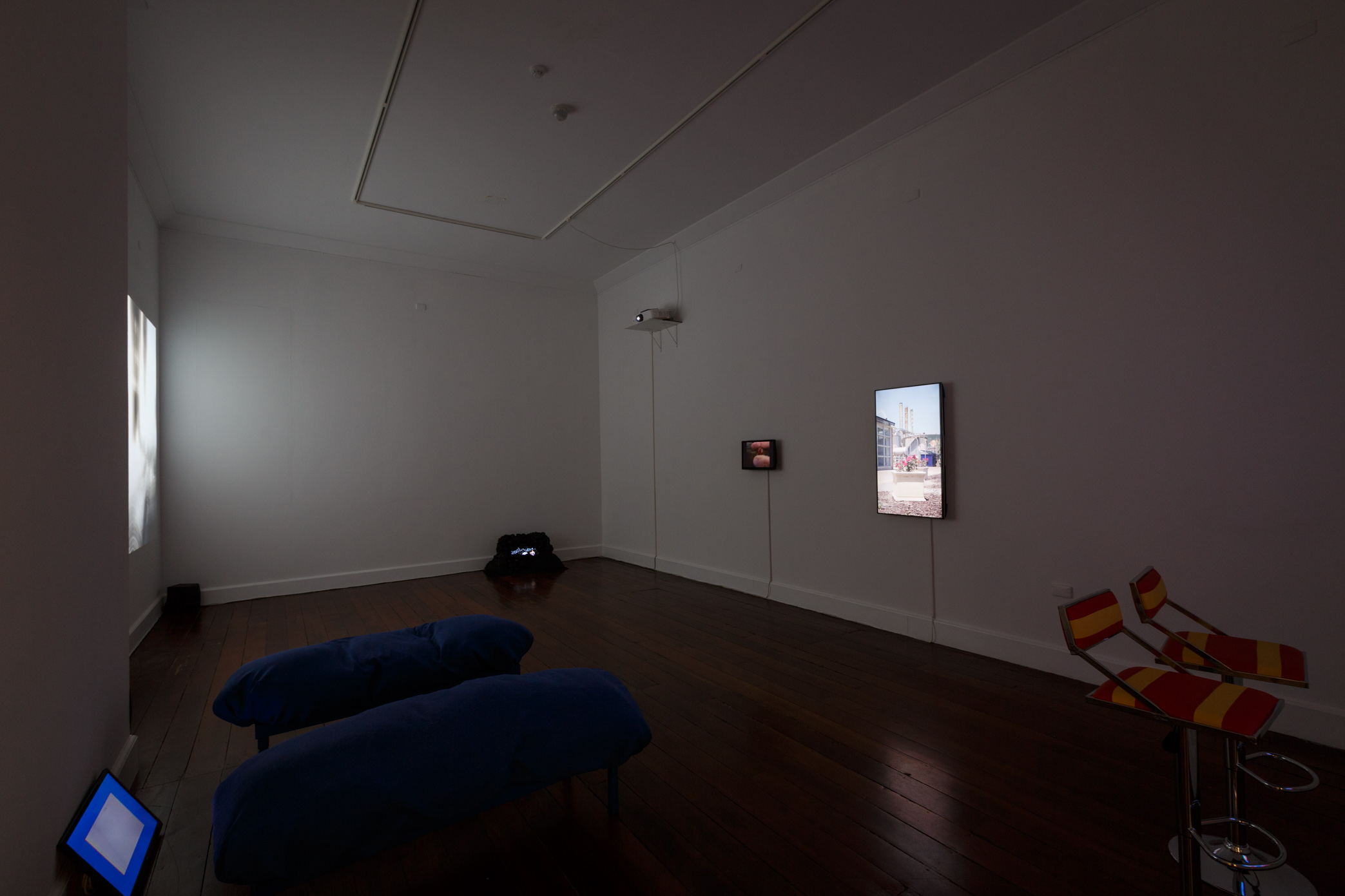 Warp features eight individual video works presented across various-sized screens including projections, television screens and phone screens. Each work is a unique look at the way the internet and screen-based technology permeates our lives.