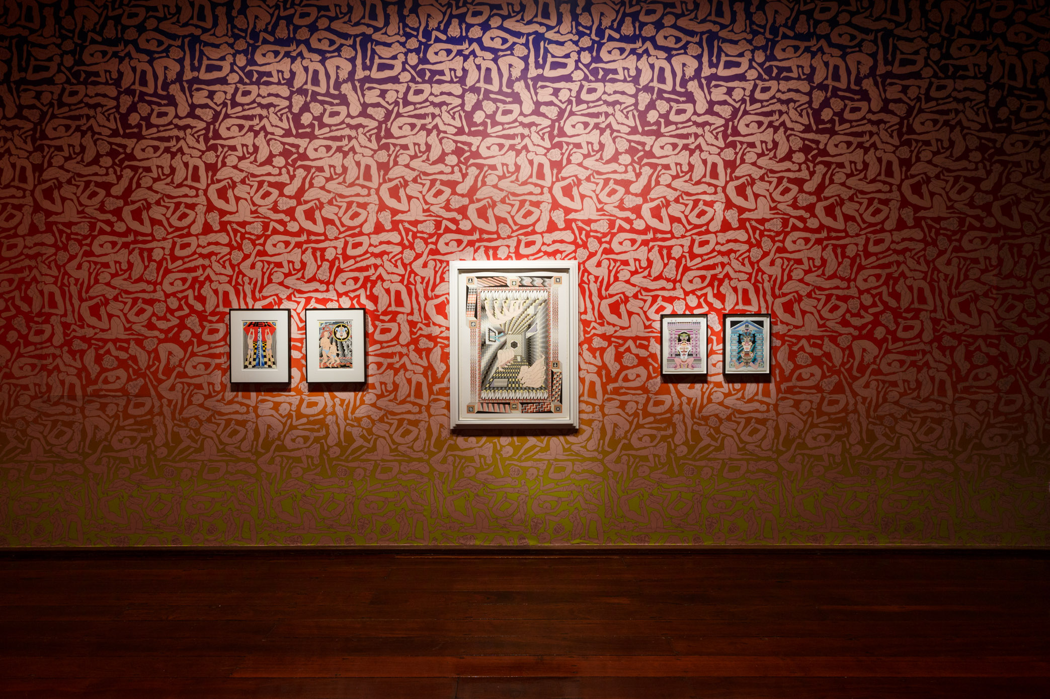 Jess Johnson’s Hex Nemesis exhibition sees FAC’s gallery covered with wallpaper featuring fleshy figures in various poses of supplication. Embedded amongst this installation is a series of her drawings that showcase her signature mind-bending reality, filled with impossible architecture and humanoid figures. The gallery also features a geometric installation built directly onto the fireplace with one of Johnson’s designs sitting above it.