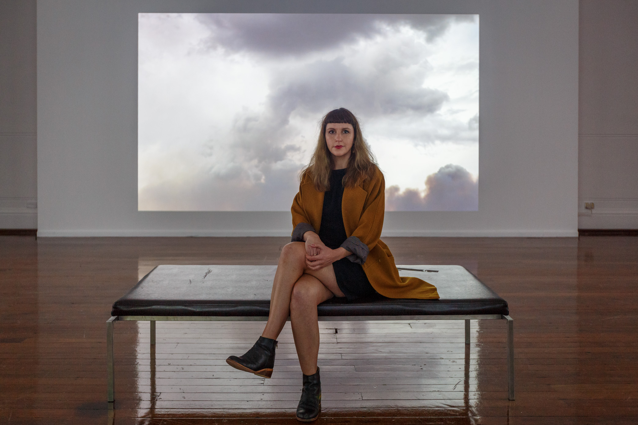 Melbourne-based artist Claire Robertson’s cinematic installation depicts an uninhabited temporary mining camp in the Pilbara, showing scenes of empty industrial villages set against the Australian outback. The installation is accompanied by a haunting original soundtrack by composer Tilman Robinson.