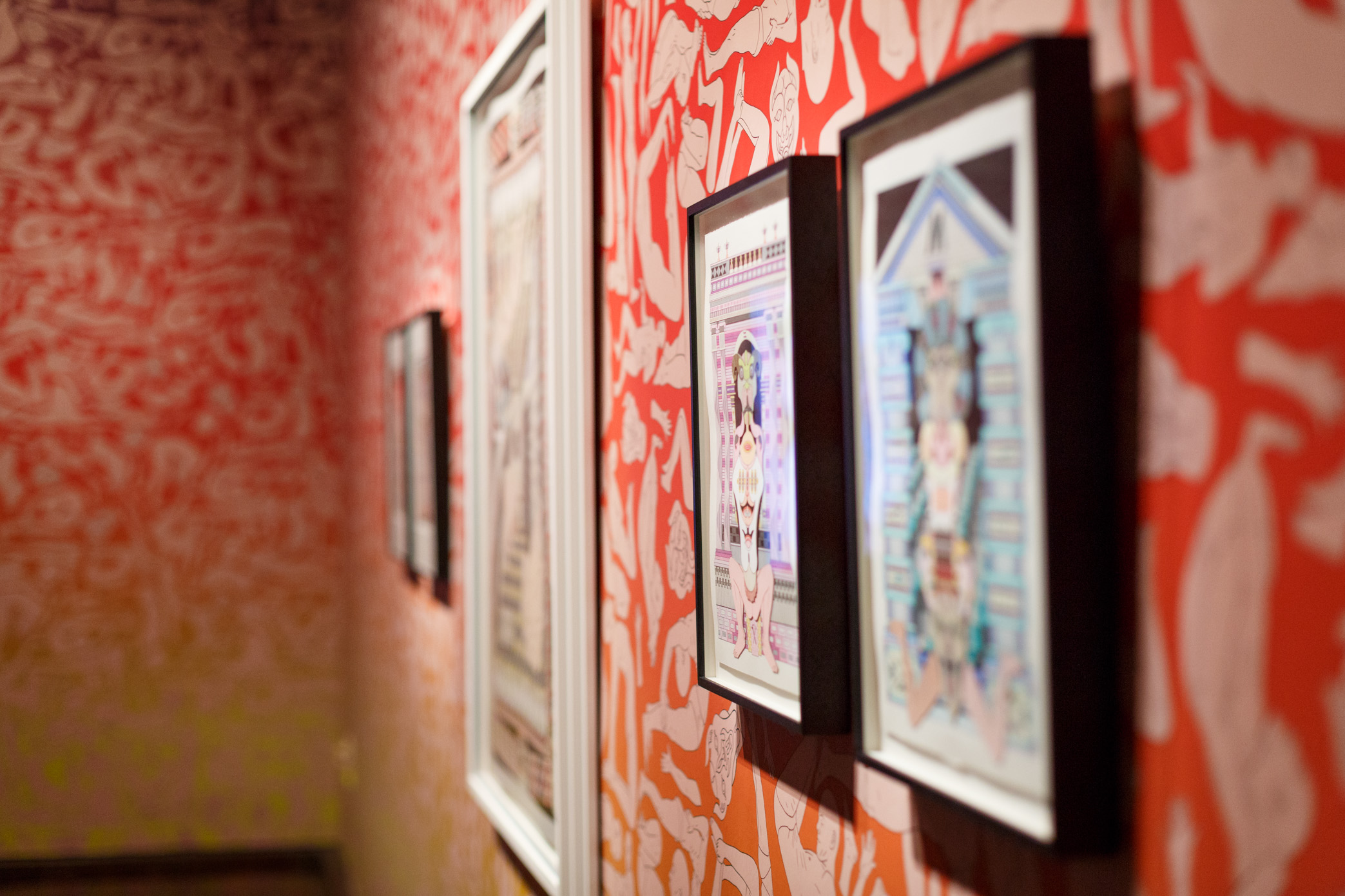 Jess Johnson’s Hex Nemesis exhibition sees FAC’s gallery covered with wallpaper featuring fleshy figures in various poses of supplication. Embedded amongst this installation is a series of her drawings that showcase her signature mind-bending reality, filled with impossible architecture and humanoid figures. The gallery also features a geometric installation built directly onto the fireplace with one of Johnson’s designs sitting above it.