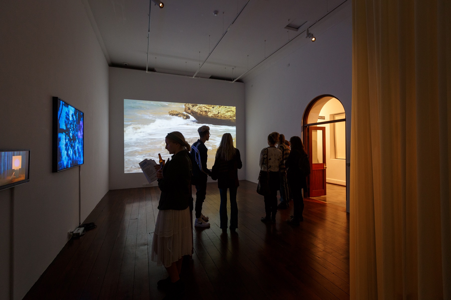 Warp features eight individual video works presented across various-sized screens including projections, television screens and phone screens. Each work is a unique look at the way the internet and screen-based technology permeates our lives.